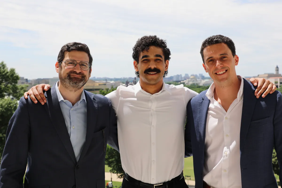 The CustomAI Studio founding team outside the venue